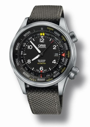 The Oris Big Crown ProPilot Altimeter is available in three different textile straps: grey, green and black. Here shown with the grey textile strap and feet scale.